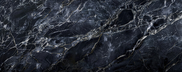 Obraz premium A dark black textured surface with a smooth, slightly grainy finish that resembles polished stone. The texture adds an elegant, timeless quality.