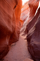 The stunning beauty of Wire Pass Slot Canyon in Utah, featuring impressive textured pink rock walls bathed in natural morning sunlight. The beautiful geological sandstone erosion - USA