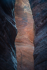 The intricate rock texture and dramatic light within Wire Pass Slot Canyon in Southern Utah. This natural wonder offers a glimpse into geological forces and the beauty of untouched landscapes - USA