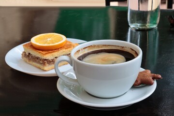 cup of coffee and tasty apple pie in cafe