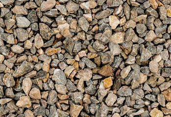 gravel hard texture close up, stone brown background
