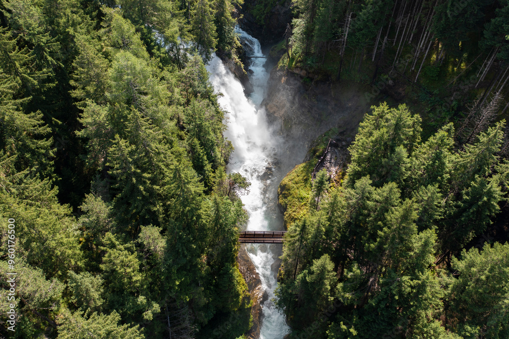 Wall mural aerial view of the highest waterfall of the riva campo tures complex