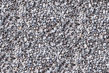 stone light beach close-up of round cobblestones big and small