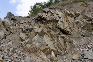 Rough rock formation on cliff
