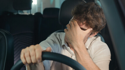 Frustrated stressed worried irritated angry Caucasian driver worry about traffic jam lateness...