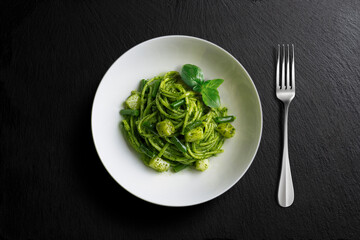 Bowl with linguine with Genoese pesto sauce with potatoes and green beans