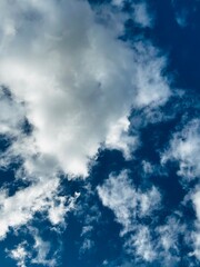 Clouds on a sunny day with blue sky in the background.