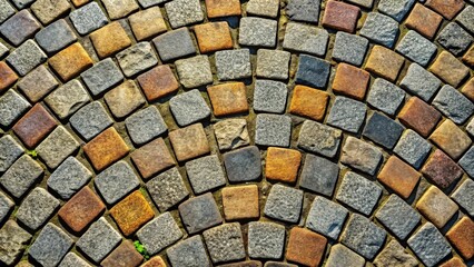 Close-up view of old granite cobblestones lined with an arc