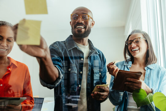 Diverse team brainstorming and sharing ideas during a business workshop