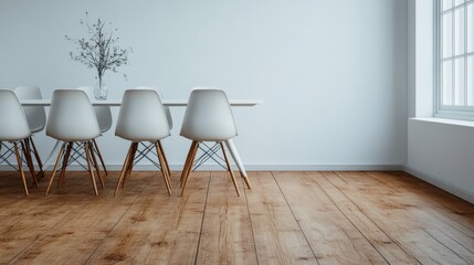 A minimalist dining room showcases a clean design with white chairs lining a wooden dining table on a polished wood floor, accented by a simple vase with branches.