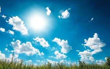 Fototapeta premium A scenic view of a clear blue sky filled with fluffy clouds, illuminated by the bright sun. Perfect for nature-themed projects.
