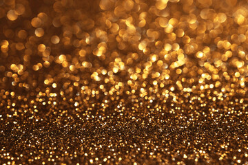 Golden glitter festive bokeh background, abstract defocused texture. Holiday lights