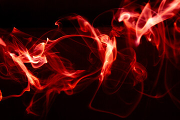 Illustration of red beautiful smoke on the black background 