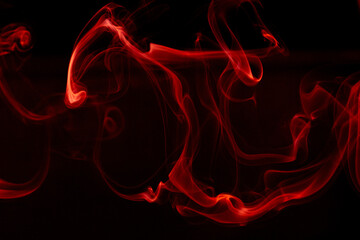 Illustration of red beautiful smoke on the black background 