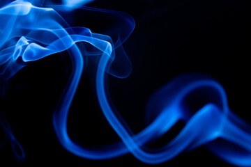 Illustration of blue beautiful smoke on the black background 