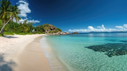 Fototapeta premium A panoramic view of a tropical beach on the Mamanuca Islands with clear blue skies.