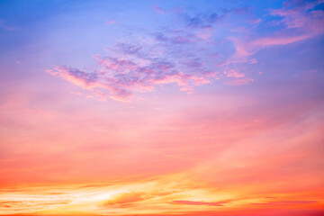 Obraz premium Beautiful , luxury soft gradient orange gold clouds and sunlight on the blue sky perfect for the background, take in everning,Twilight, Large size, high definition landscape photo