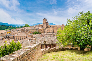 Fototapeta premium A view along a wall towards the center of the city in Urbino, Italy in summertime