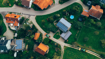 Drone Aerial View of Village Rooftops and Farm in Germany with Solar Panels