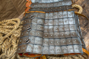 traditional warrior protection iron plates on a leather base close-up