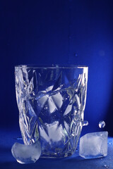 different cold ice cubes on a blue background