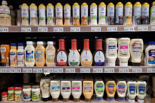 Penang, Malaysia - Sep 4, 2024: A selection of salad dressings and condiments displayed on supermarket shelves in Penang, Malaysia.