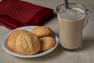 A plate with homemade cookies and a cup of coffee