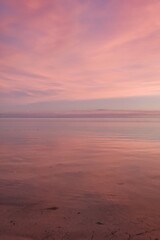 Purple sky over water with almost no horizon. Stunning evening sky just after sunset. Yasawa Islands natural beauty. Fiji beautiful sunset scene. Invisible horizon. Deep purple sky reflects the ocean