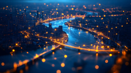 Fototapeta premium Aerial view of a cityscape with illuminated river and bridges.