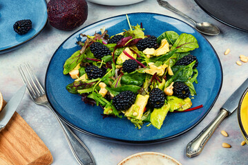 Plate of colorful fresh salad.