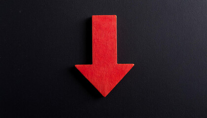 Red wooden arrow pointing down on black background. Business, market decline or economic