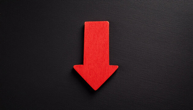 Red wooden arrow pointing down on black background. Business, market decline or economic