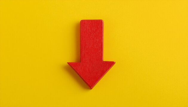 Red wooden arrow pointing down on yellow background. Business, market decline or economic