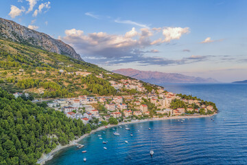 Fototapeta premium Stanici village with main beach and boats on sea near the Omis in Croatia