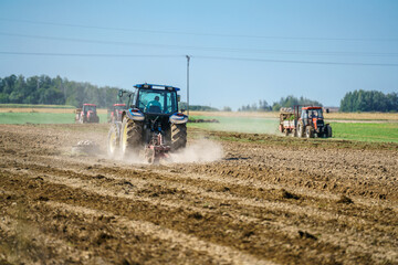 Obraz premium A tractor plowing a field