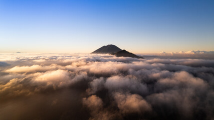 Epic view of the Agung volcano over the clouds at Bali, Indonesia