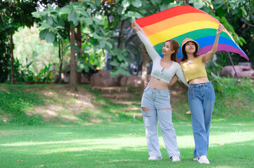 Couple of girl with girl,LGBT Pride month concept,Asian Handsome male make up and wear woman cloth,Gay Freedom Day,Portrait of Non-binary on white background