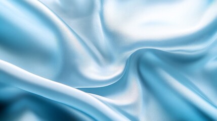 Obraz premium A close-up view of smooth, flowing blue satin fabric, showcasing its texture and sheen.