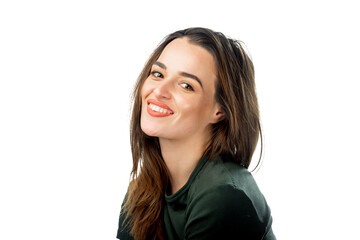 Fototapeta premium Woman in a green shirt smiling against a white background. A woman with long, flowing hair smiles warmly while wearing a green shirt