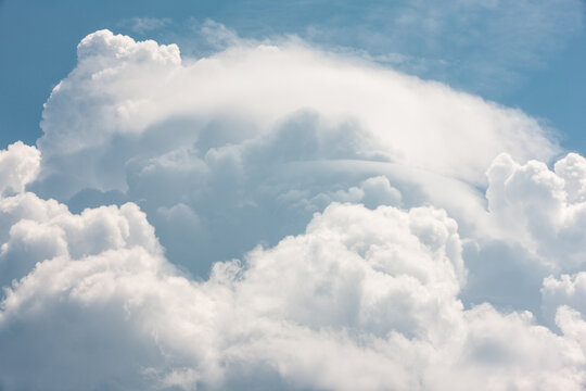 Billowing clouds almost look like mountains in the sky over Harrington Beach State Park, Belgium, Wisconsin in mid-May
