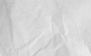 White crumpled craft paper texture as background. Light grey paper texture, Old vintage page or grunge vignette of old newspaper. Pattern rough art creased grunge letter with copy space for text.