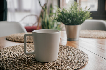 Coffee cup on wooden table in coffee shop, stock photo