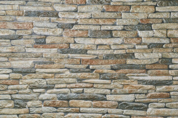 blurry natural stone wall surface background, small thin layers of stones with mortar empty space for product or food photography backdrop, abstract wallpaper for graphic design