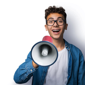 Funny happy brunette young man wear glasses dent dental tooth braces brackets advertise use mega phone megaphone loudspeaker open mouth, isolate over white background. Sales ad concept