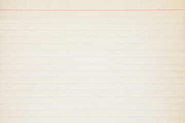Naklejka premium Weathered yellowed old paper notebook with lines background texture