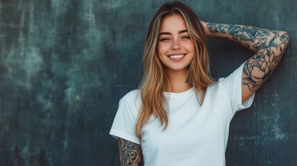 Fototapeta premium Stylish girl with tattoos in modern streetwear smiling against a textured backdrop