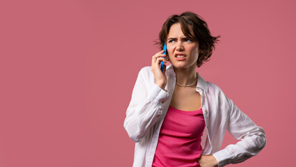 Annoyed Young Woman Quarreling While Talking On Mobile Phone. Angry Lady