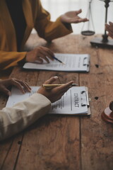 Business and lawyers discussing contract papers with brass scale on desk in office. Law, legal...