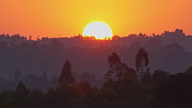A serene African sunset casting warm hues over a tranquil valley Burundi