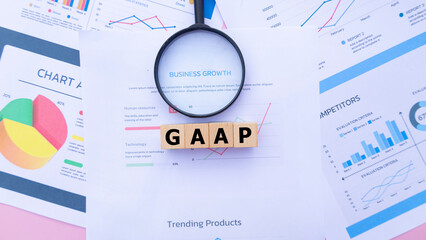 Wooden cubes with the word GAAP, abbreviation for Generally Accepted Accounting Principles. Business profitability analysis, growth success, profitability. Business and financial market concepts.